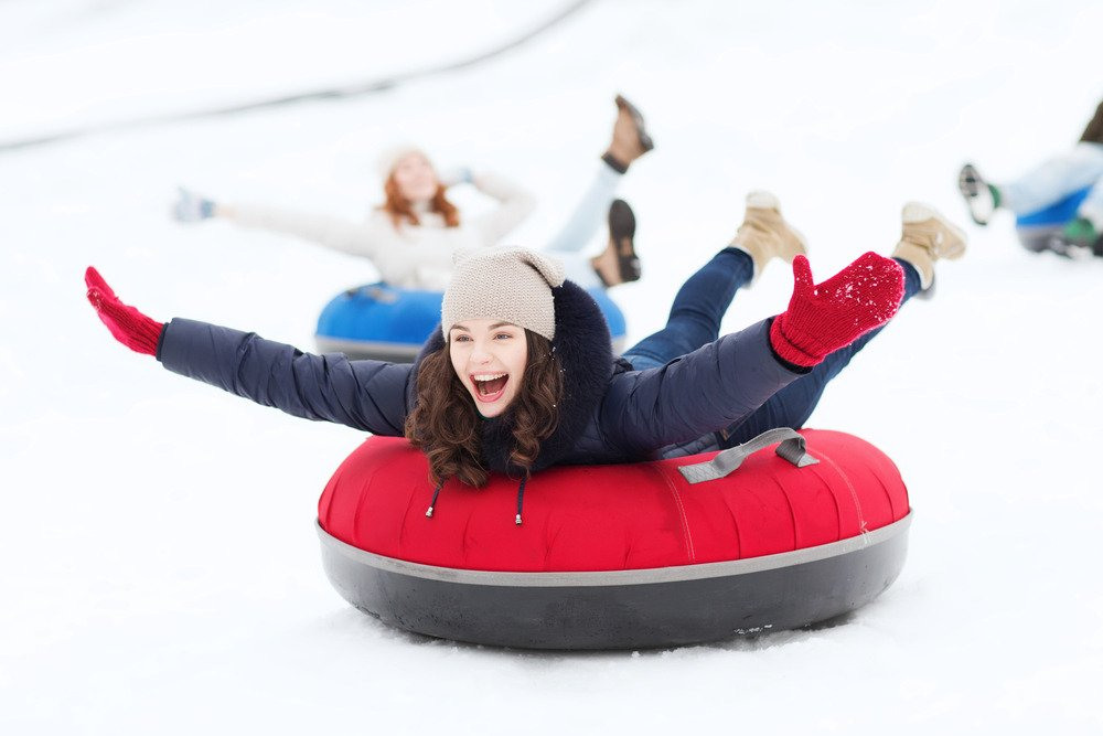 sledding tobogganing and tubing